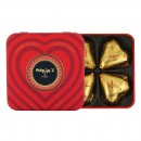Boîte métal 4 coeurs chocolat au lait fondant truffés de praliné feuilletine